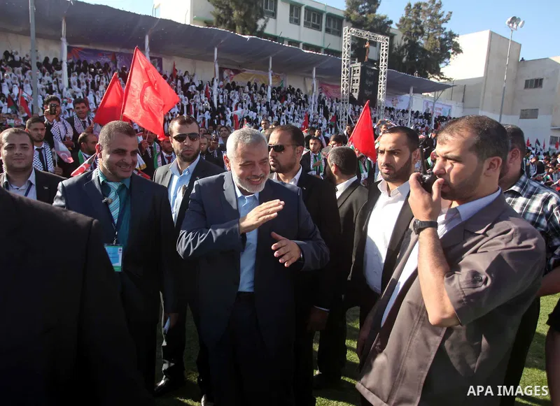 Senior Hamas leader Ismail Haniyeh attends a mass wedding ceremony in Gaza City, on May 31, 2015. Nearly 2000 Palestinian couples were married in a ceremony funded by the Turkish government and supported by the Hamas mov...