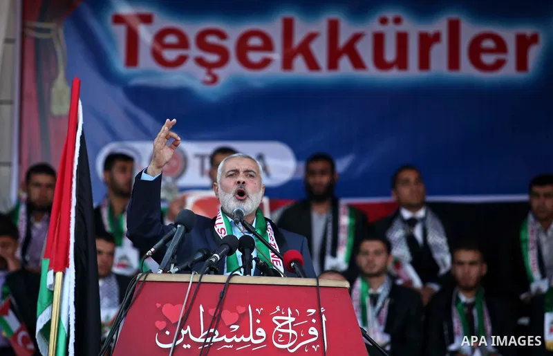 Senior Hamas leader Ismail Haniyeh gives a speech during a mass wedding ceremony in Gaza City, on May 31, 2015. Nearly 2000 Palestinian couples were married in a ceremony funded by the Turkish government and supported by...