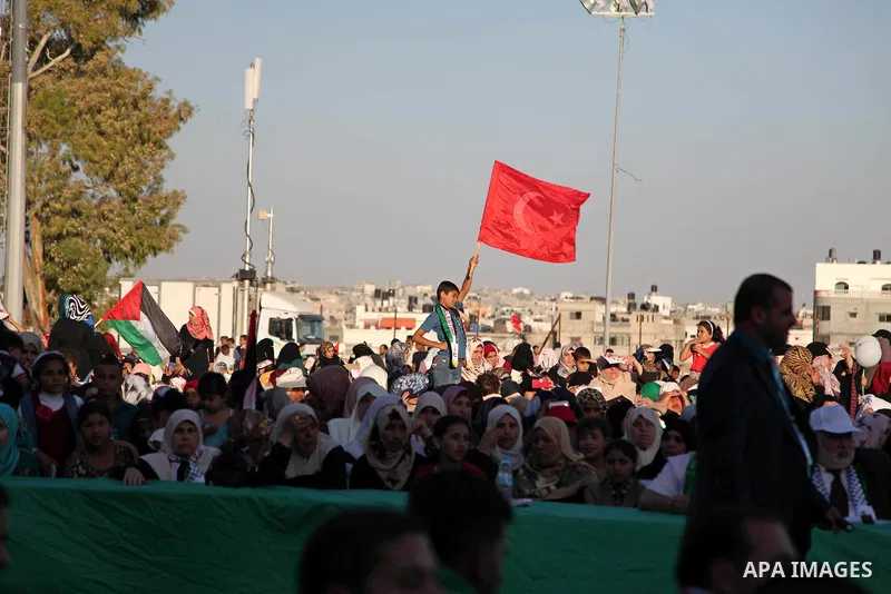 Palestinians attend a a mass wedding ceremony in Gaza City, on May 31, 2015. Nearly 2000 Palestinian couples were married in a ceremony funded by the Turkish government and supported by the Hamas movement. Photo by Ashra...