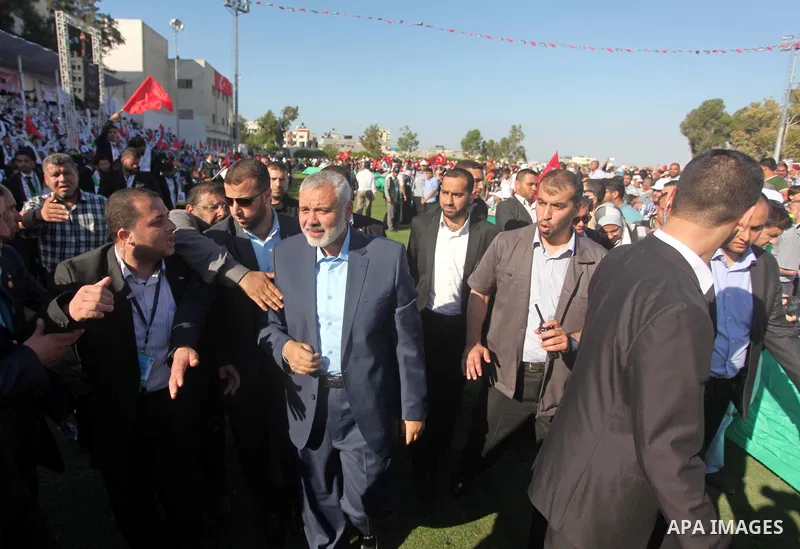 Senior Hamas leader Ismail Haniyeh attends a mass wedding ceremony in Gaza City, on May 31, 2015. Nearly 2000 Palestinian couples were married in a ceremony funded by the Turkish government and supported by the Hamas mov...