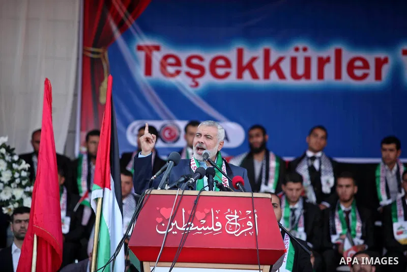 Senior Hamas leader Ismail Haniyeh gives a speech during a mass wedding ceremony in Gaza City, on May 31, 2015. Nearly 2000 Palestinian couples were married in a ceremony funded by the Turkish government and supported by...