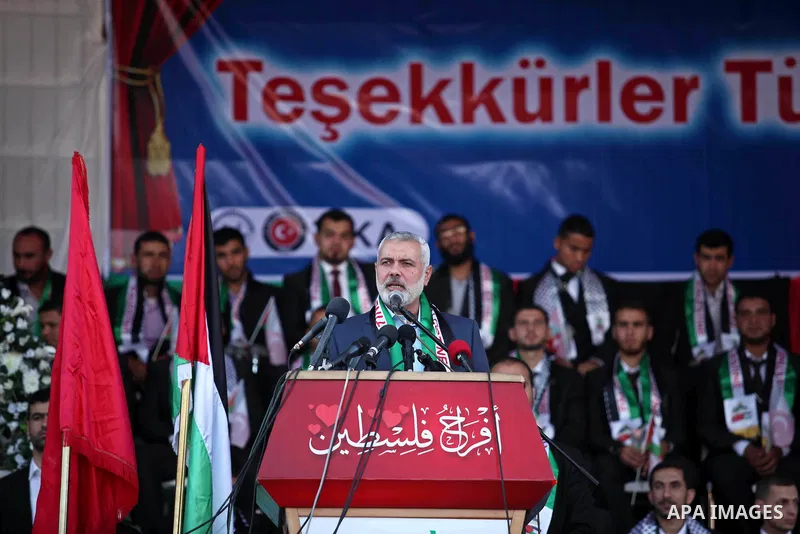 Senior Hamas leader Ismail Haniyeh gives a speech during a mass wedding ceremony in Gaza City, on May 31, 2015. Nearly 2000 Palestinian couples were married in a ceremony funded by the Turkish government and supported by...