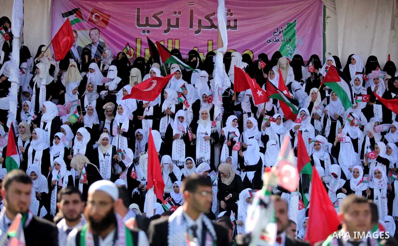 Palestinian grooms take part in a mass wedding ceremony in Gaza City, on May 31, 2015. Nearly 2000 Palestinian couples were married in a ceremony funded by the Turkish government and supported by the Hamas movement. Phot...