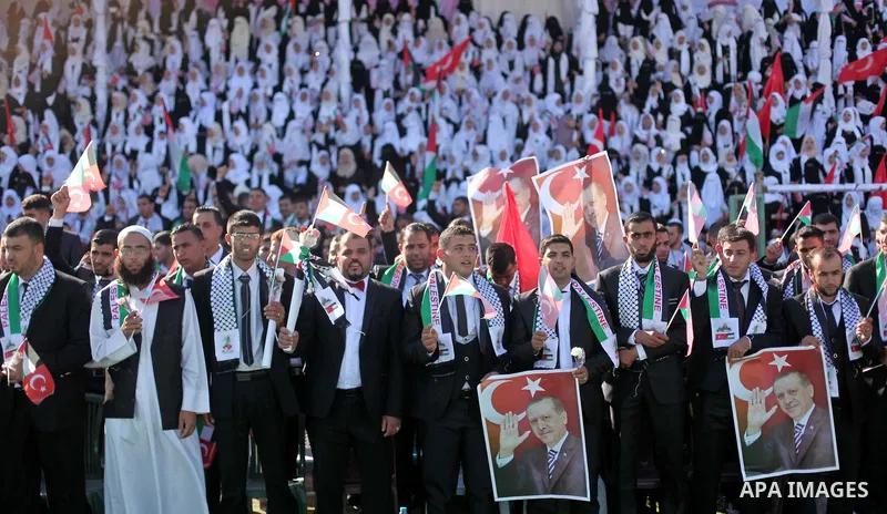 Palestinian grooms take part in a mass wedding ceremony in Gaza City, on May 31, 2015. Nearly 2000 Palestinian couples were married in a ceremony funded by the Turkish government and supported by the Hamas movement. Phot...