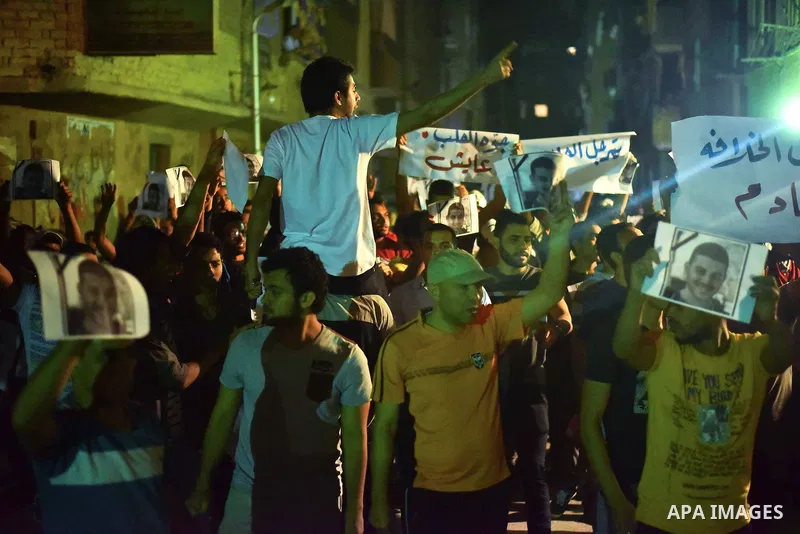 Egyptian youths who support ousted President Mohamed Morsi and the Muslim Brotherhood take part in a protest against killing of their fellow, in Cairo, on May 31, 2015. Photo by Stringer