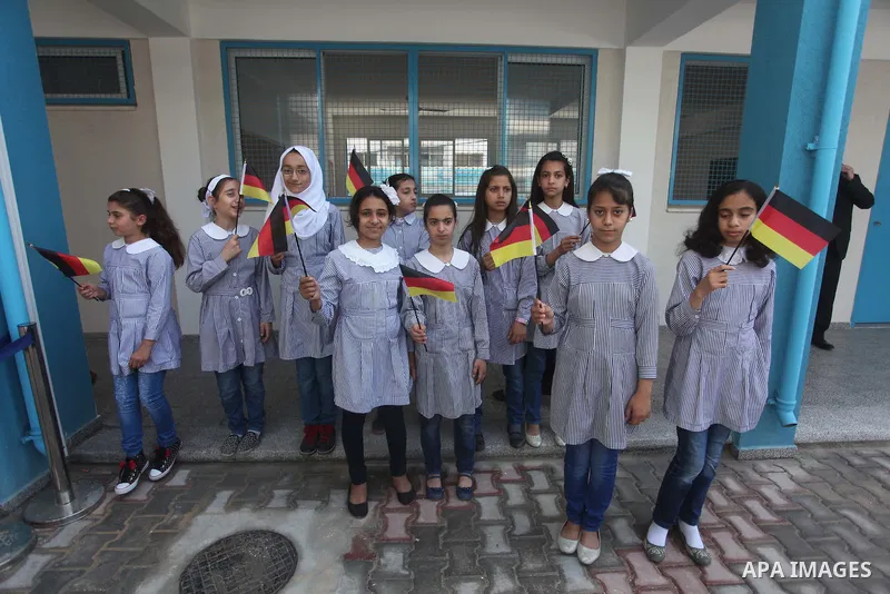 German Foreign Minister Frank-Walter Steinmeier visits a United Nations-run school in Gaza City, on June 1, 2015. Steinmeier is visiting the strip as part of a regional tour to assess peace prospects between Israelis and...