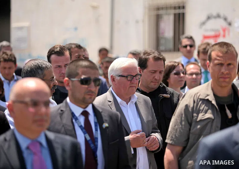 German Foreign Minister Frank-Walter Steinmeier walks next to a destroyed rooms of Palestinian fishermen, damaged during Israeli Hamas conflict of 2014, in Gaza port, during his visit to Gaza City, 01 June 2015. Steinmei...
