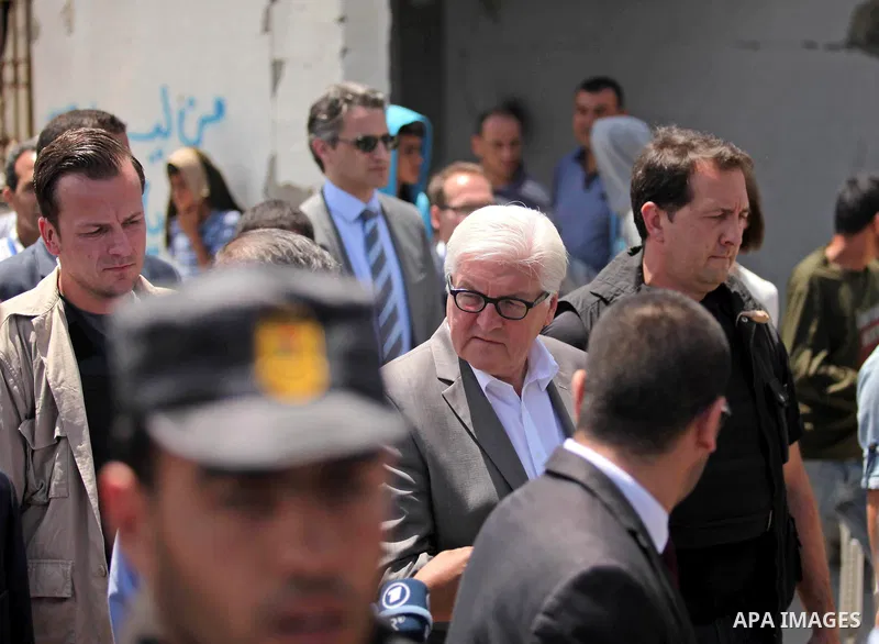 German Foreign Minister Frank-Walter Steinmeier walks next to a destroyed rooms of Palestinian fishermen, damaged during Israeli Hamas conflict of 2014, in Gaza port, during his visit to Gaza City, 01 June 2015. Steinmei...