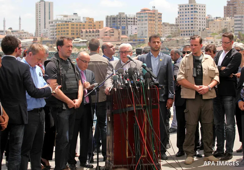 German Foreign Minister Frank-Walter Steinmeier speaks to media following his visit to destroyed rooms of Palestinian fishermen, damaged during Israeli Hamas conflict of 2014, in Gaza port, during his visit to Gaza City,...