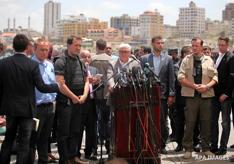 German Foreign Minister Frank-Walter Steinmeier speaks to media following his visit to destroyed rooms of Palestinian fishermen, damaged during Israeli Hamas conflict of 2014, in Gaza port, during his visit to Gaza City,...