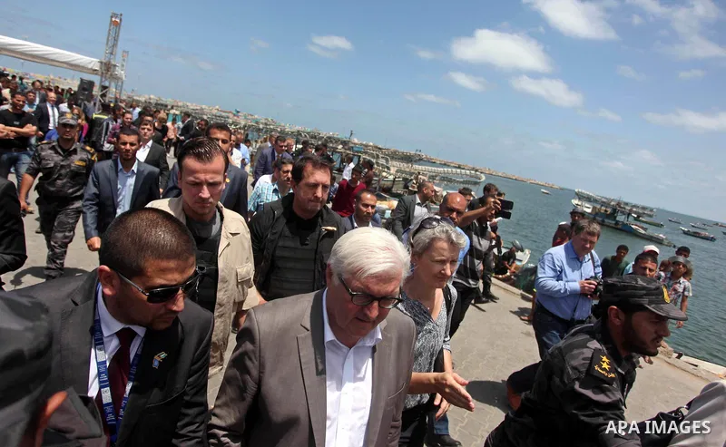 German Foreign Minister Frank-Walter Steinmeier walks next to a destroyed rooms of Palestinian fishermen, damaged during Israeli Hamas conflict of 2014, in Gaza port, during his visit to Gaza City, 01 June 2015. Steinmei...