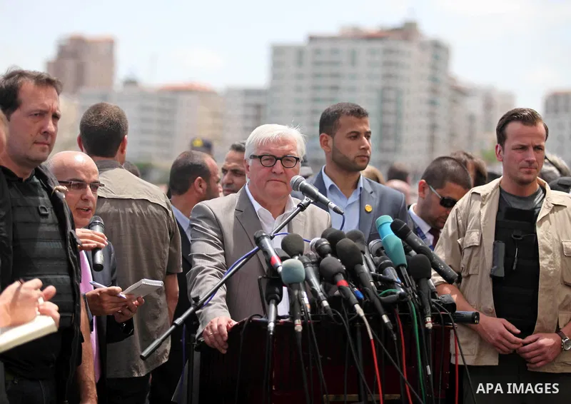 German Foreign Minister Frank-Walter Steinmeier speaks to media following his visit to destroyed rooms of Palestinian fishermen, damaged during Israeli Hamas conflict of 2014, in Gaza port, during his visit to Gaza City,...