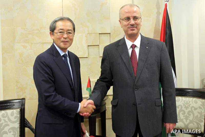 Palestinian Prime Minister Rami Hamdallah meets with Japanese envoy to the Middle East Masahiro Chono, in the West Bank city of Ramallah on June 1, 2015. Photo by Prime Minister Office