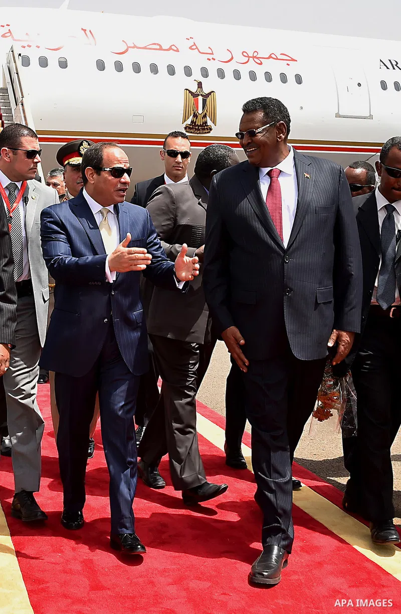 A handout picture released by the Egyptian Presidency shows Egyptian President Abdel-Fattah al-Sisi arrives to the Sudan, on june 2, 2015. Photo by Egyptian Presidency