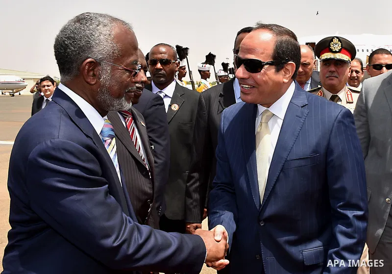 A handout picture released by the Egyptian Presidency shows Egyptian President Abdel-Fattah al-Sisi arrives to the Sudan, on june 2, 2015. Photo by Egyptian Presidency