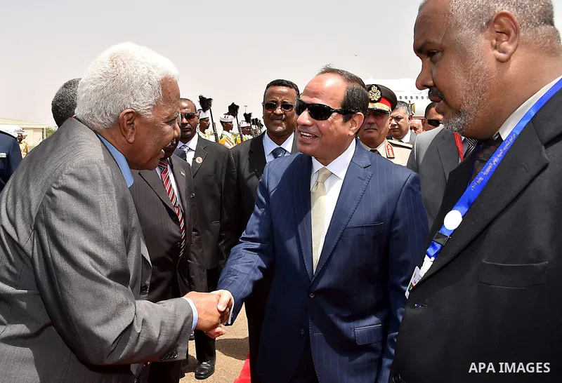 A handout picture released by the Egyptian Presidency shows Egyptian President Abdel-Fattah al-Sisi arrives to the Sudan, on june 2, 2015. Photo by Egyptian Presidency