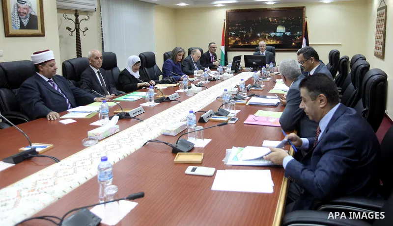 Palestinian Prime Minister Rami Hamdallah chairs a meeting of council of ministers, in the West Bank city of Ramallah on June 2, 2015. Photo by Prime Minister Office