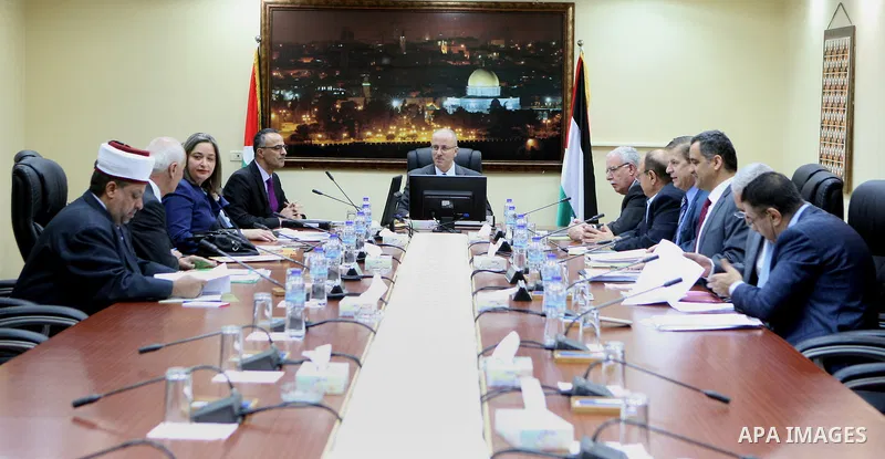 Palestinian Prime Minister Rami Hamdallah chairs a meeting of council of ministers, in the West Bank city of Ramallah on June 2, 2015. Photo by Prime Minister Office