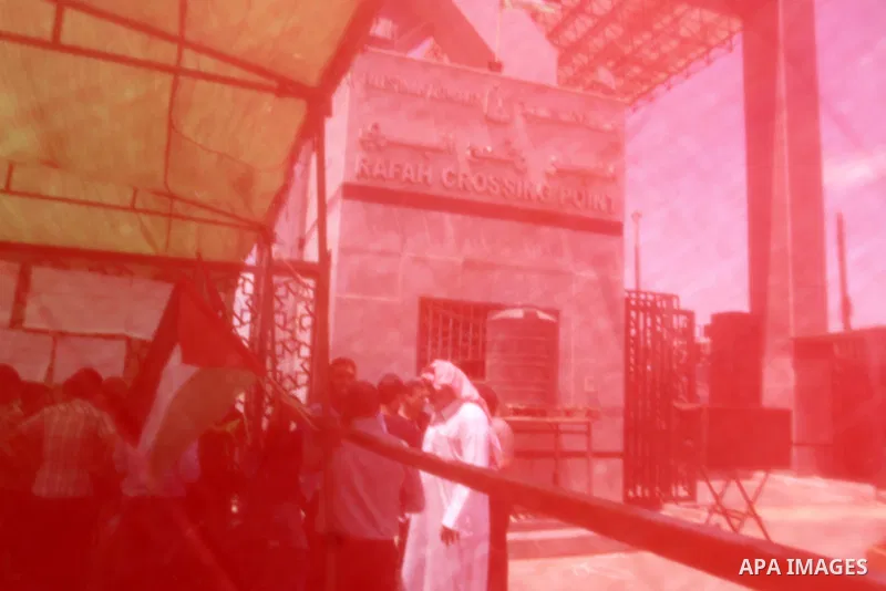 Palestinians take part in a protest demanding opening Rafah crossing border between Egypt and Gaza Strip, in Rafah in the southern Gaza Strip on June 2, 2015. Egyptian authorities opened the Rafah crossing last week for...