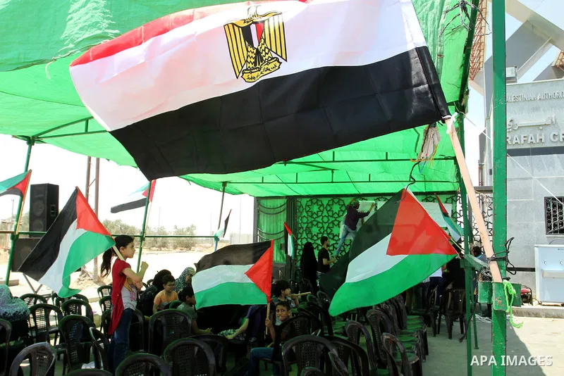Palestinians take part in a protest demanding opening Rafah crossing border between Egypt and Gaza Strip, in Rafah in the southern Gaza Strip on June 2, 2015. Egyptian authorities opened the Rafah crossing last week for...