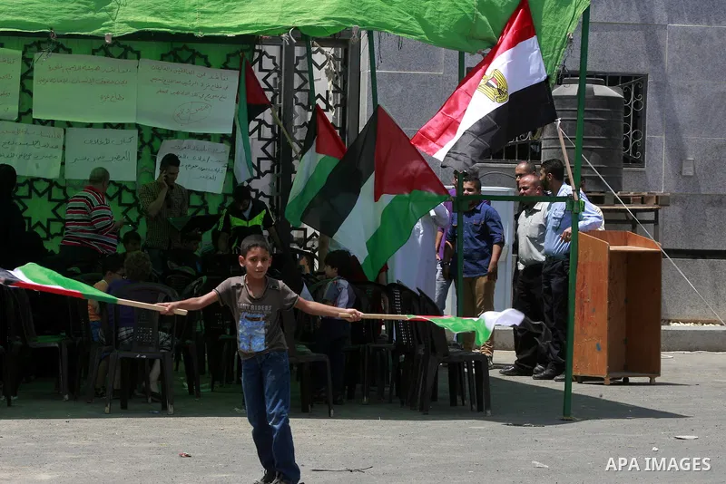 Palestinians take part in a protest demanding opening Rafah crossing border between Egypt and Gaza Strip, in Rafah in the southern Gaza Strip on June 2, 2015. Egyptian authorities opened the Rafah crossing last week for...
