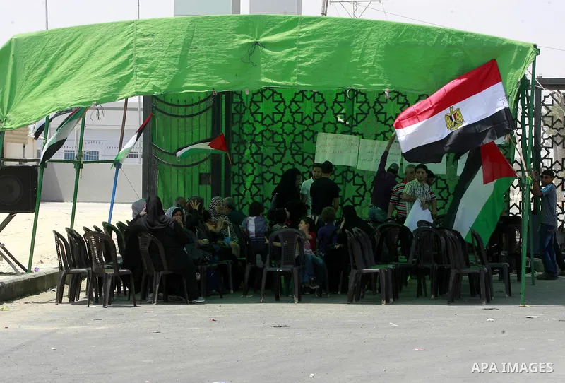 Palestinians take part in a protest demanding opening Rafah crossing border between Egypt and Gaza Strip, in Rafah in the southern Gaza Strip on June 2, 2015. Egyptian authorities opened the Rafah crossing last week for...