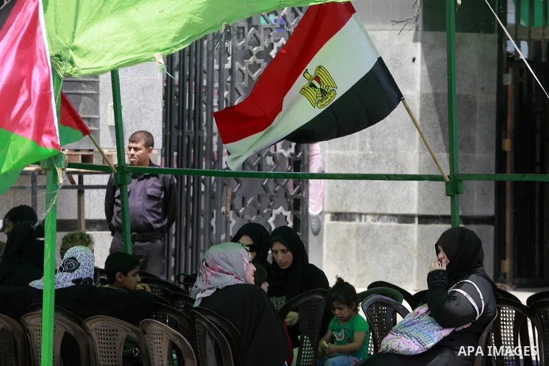 Palestinians take part in a protest demanding opening Rafah crossing border between Egypt and Gaza Strip, in Rafah in the southern Gaza Strip on June 2, 2015. Egyptian authorities opened the Rafah crossing last week for...