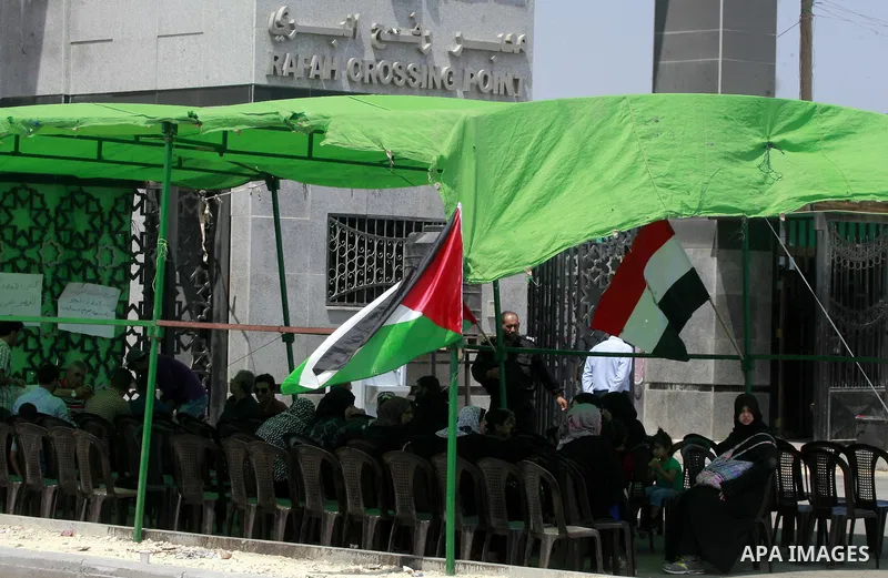 Palestinians take part in a protest demanding opening Rafah crossing border between Egypt and Gaza Strip, in Rafah in the southern Gaza Strip on June 2, 2015. Egyptian authorities opened the Rafah crossing last week for...