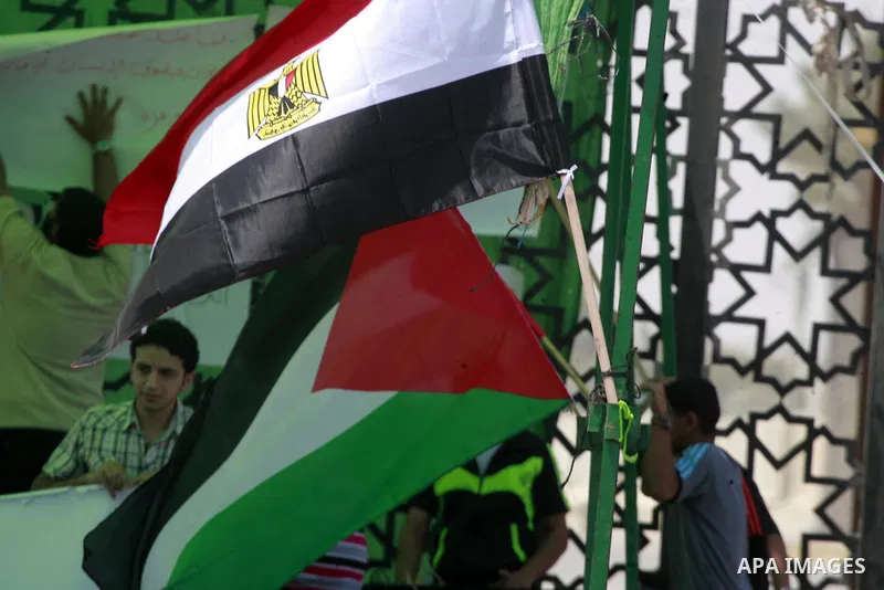 Palestinians take part in a protest demanding opening Rafah crossing border between Egypt and Gaza Strip, in Rafah in the southern Gaza Strip on June 2, 2015. Egyptian authorities opened the Rafah crossing last week for...
