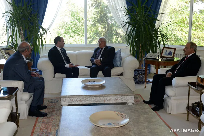 Palestinian President Mahmoud Abbas meets with Jordan's Prince Ali bin al-Hussein in Amman on June 2, 2015. Sepp Blatter won the FIFA presidency last week when his challenger, the Jordanian Prince, withdrew after the fir...