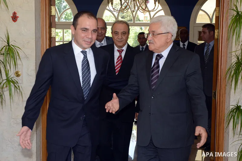 Palestinian President Mahmoud Abbas meets with Jordan's Prince Ali bin al-Hussein in Amman on June 2, 2015. Sepp Blatter won the FIFA presidency last week when his challenger, the Jordanian Prince, withdrew after the fir...