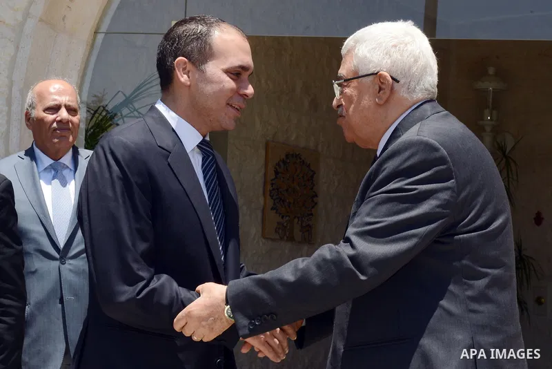 Palestinian President Mahmoud Abbas meets with Jordan's Prince Ali bin al-Hussein in Amman on June 2, 2015. Sepp Blatter won the FIFA presidency last week when his challenger, the Jordanian Prince, withdrew after the fir...