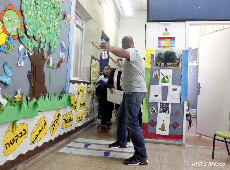 Israeli-Arab schoolchildren head to a bomb shelter at a school in Jerusalem after sirens sounded across Israel as part of country-wide massive civil defence exercise aimed at preparing the country for air or missile atta...