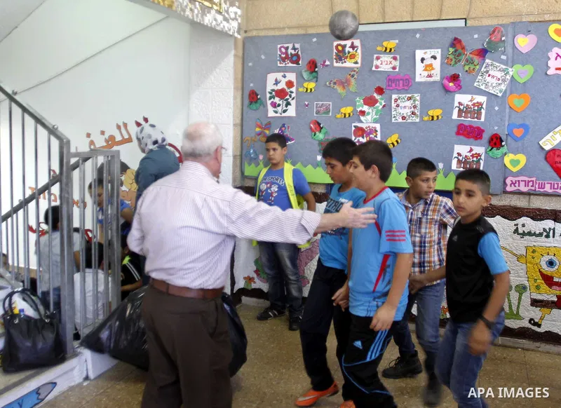 Israeli-Arab schoolchildren head to a bomb shelter at a school in Jerusalem after sirens sounded across Israel as part of country-wide massive civil defence exercise aimed at preparing the country for air or missile atta...