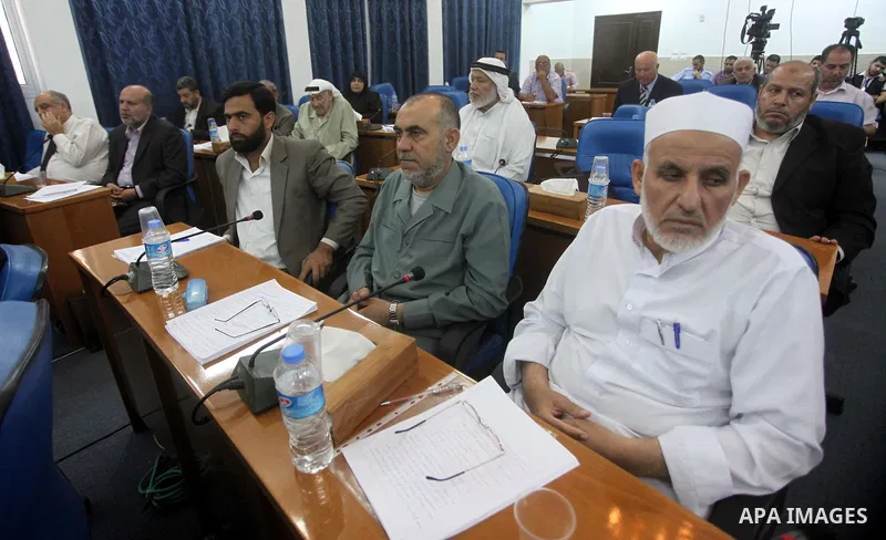 Members of the Palestinian legislative council from Hamas movement attend a meeting at the legislative council in Gaza city on June 03, 2015. Photo by Ashraf Amra