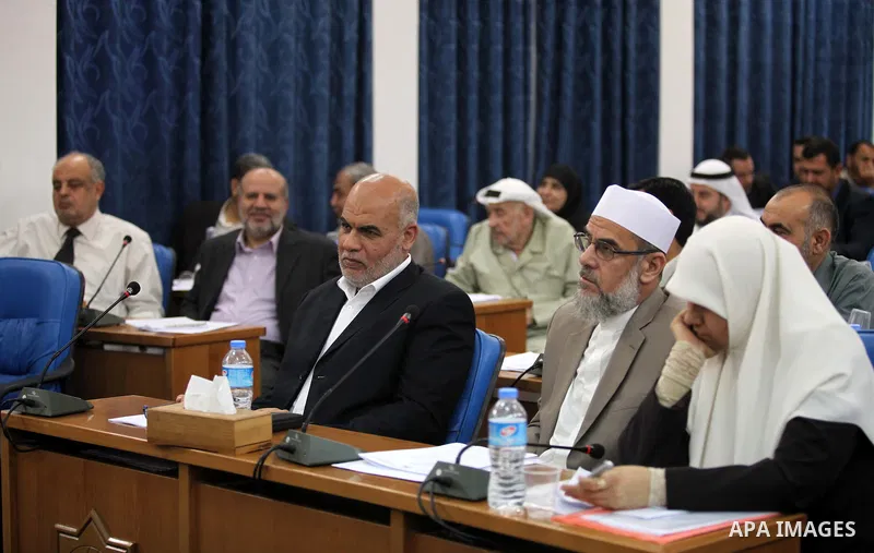 Members of the Palestinian legislative council from Hamas movement attend a meeting at the legislative council in Gaza city on June 03, 2015. Photo by Ashraf Amra