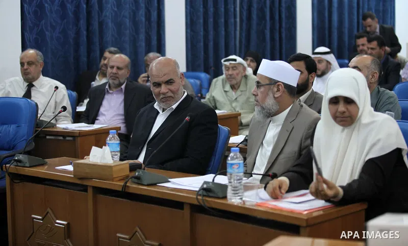 Members of the Palestinian legislative council from Hamas movement attend a meeting at the legislative council in Gaza city on June 03, 2015. Photo by Ashraf Amra