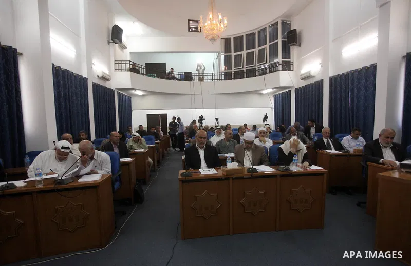 Members of the Palestinian legislative council from Hamas movement attend a meeting at the legislative council in Gaza city on June 03, 2015. Photo by Ashraf Amra