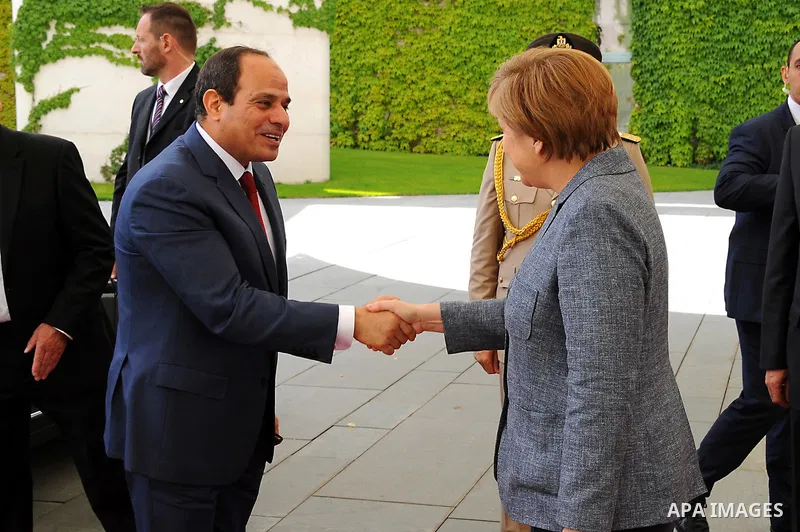 German Chancellor Angela Merkel shakes hands with Egypt's President Abdel Fattah al-Sisi as he arrives at the Chancellery in Berlin, Germany June 3. Photo by Egyptian Presidency
