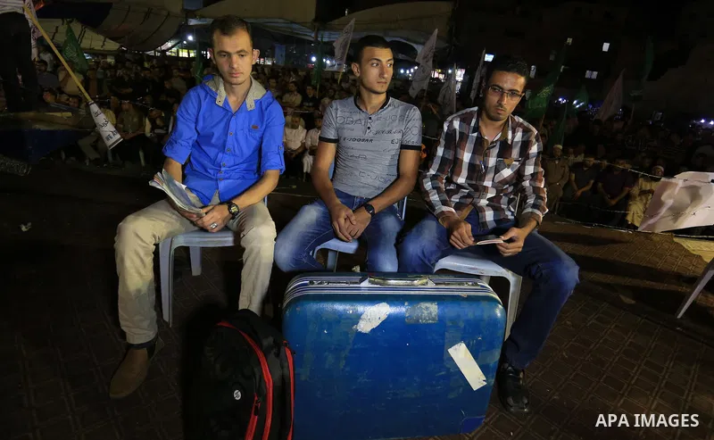 Palestinian Hamas supporters take part in a protest against the Israeli-Egyptian blockade on the Gaza Strip and demanding opening Rafah crossing border, in Khan Younis in the southern Gaza Strip on June 3, 2015. Photo by...