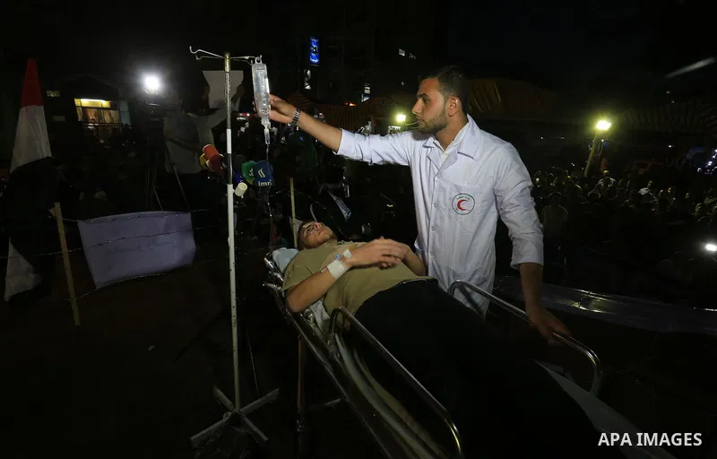 Palestinian Hamas supporters take part in a protest against the Israeli-Egyptian blockade on the Gaza Strip and demanding opening Rafah crossing border, in Khan Younis in the southern Gaza Strip on June 3, 2015. Photo by...