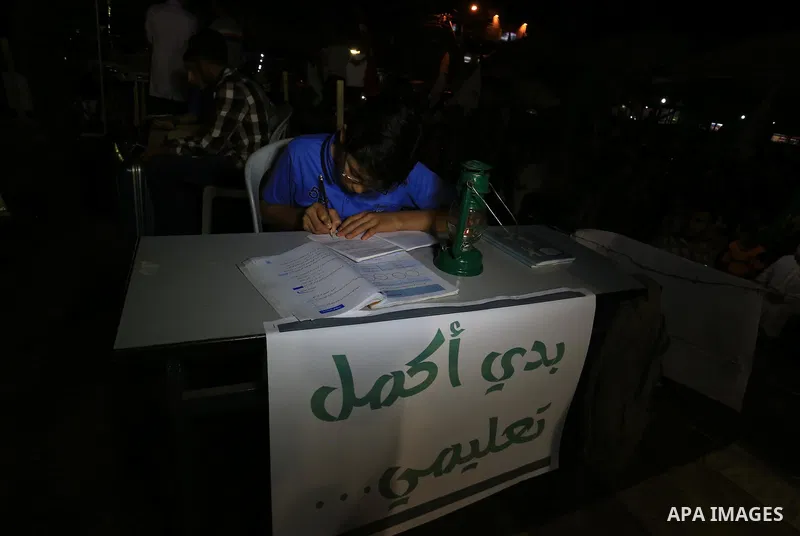 Palestinian Hamas supporters take part in a protest against the Israeli-Egyptian blockade on the Gaza Strip and demanding opening Rafah crossing border, in Khan Younis in the southern Gaza Strip on June 3, 2015. Photo by...