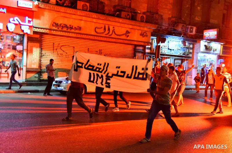 Egyptian youths who support ousted President Mohamed Morsi and the Muslim Brotherhood take part in a protest against killing of their fellow, in Cairo, on June 3, 2015. Photo by Stringer