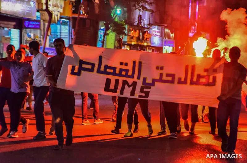 Egyptian youths who support ousted President Mohamed Morsi and the Muslim Brotherhood take part in a protest against killing of their fellow, in Cairo, on June 3, 2015. Photo by Stringer