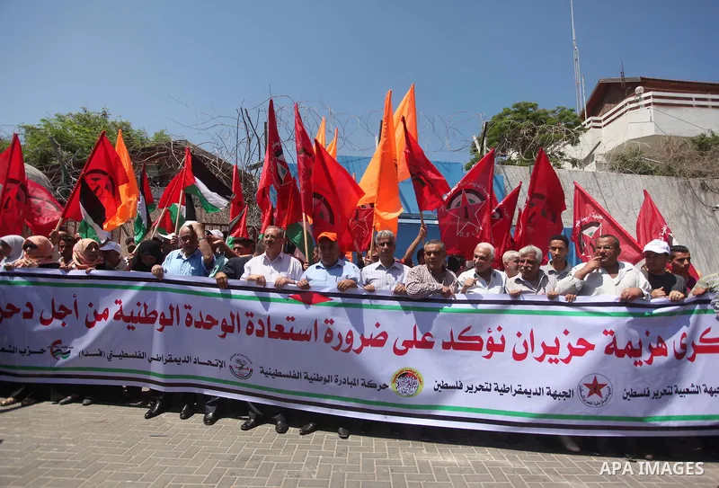 Palestinians take part in a demonstration to mark Naksa Day (setback), in front of the United Nations headcuarter in Gaza city on June 04, 2015. Palestinians mark "Naksa Day" to mourn the 48th anniversary of Israel's occ...