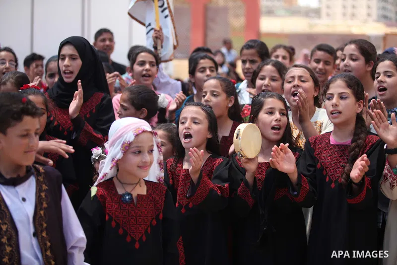 Palestinian children take part in a heritage event during the summer holiday in Gaza city on June 04, 2015. Photo by Ashraf Amra