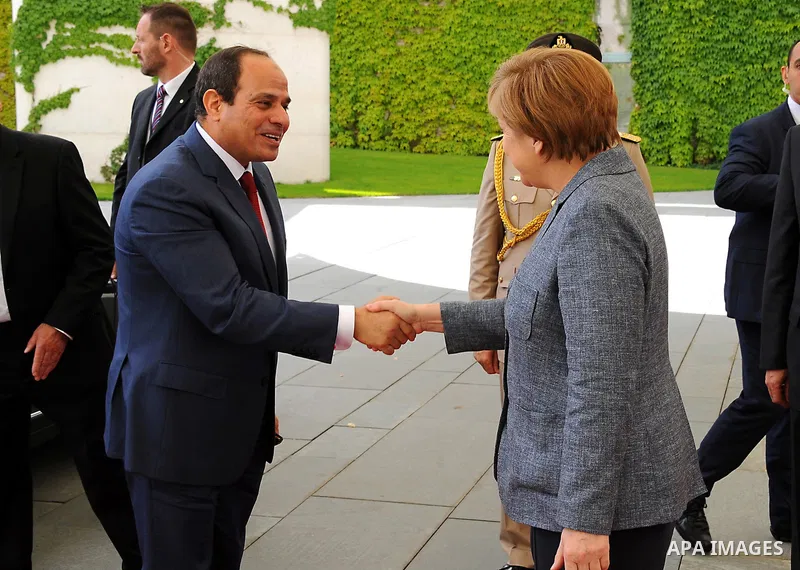 German Chancellor Angela Merkel and Egyptian President Abdel Fattah al-Sisi shake hands before a press conference on June 3, 2015 at the Chancellery in Berlin. Photo by Egyptian Presidency