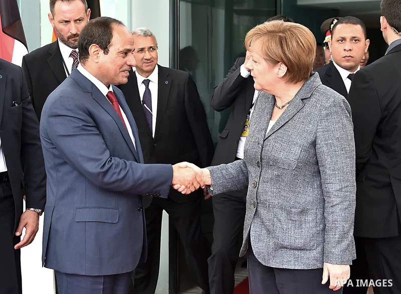 German Chancellor Angela Merkel and Egyptian President Abdel Fattah al-Sisi shake hands before a press conference on June 3, 2015 at the Chancellery in Berlin. Photo by Egyptian Presidency