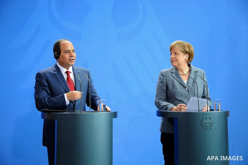 German Chancellor Angela Merkel and Egyptian President Abdel Fattah al-Sisi shake hands attend a press conference on June 3, 2015 at the Chancellery in Berlin. Photo by Egyptian Presidency