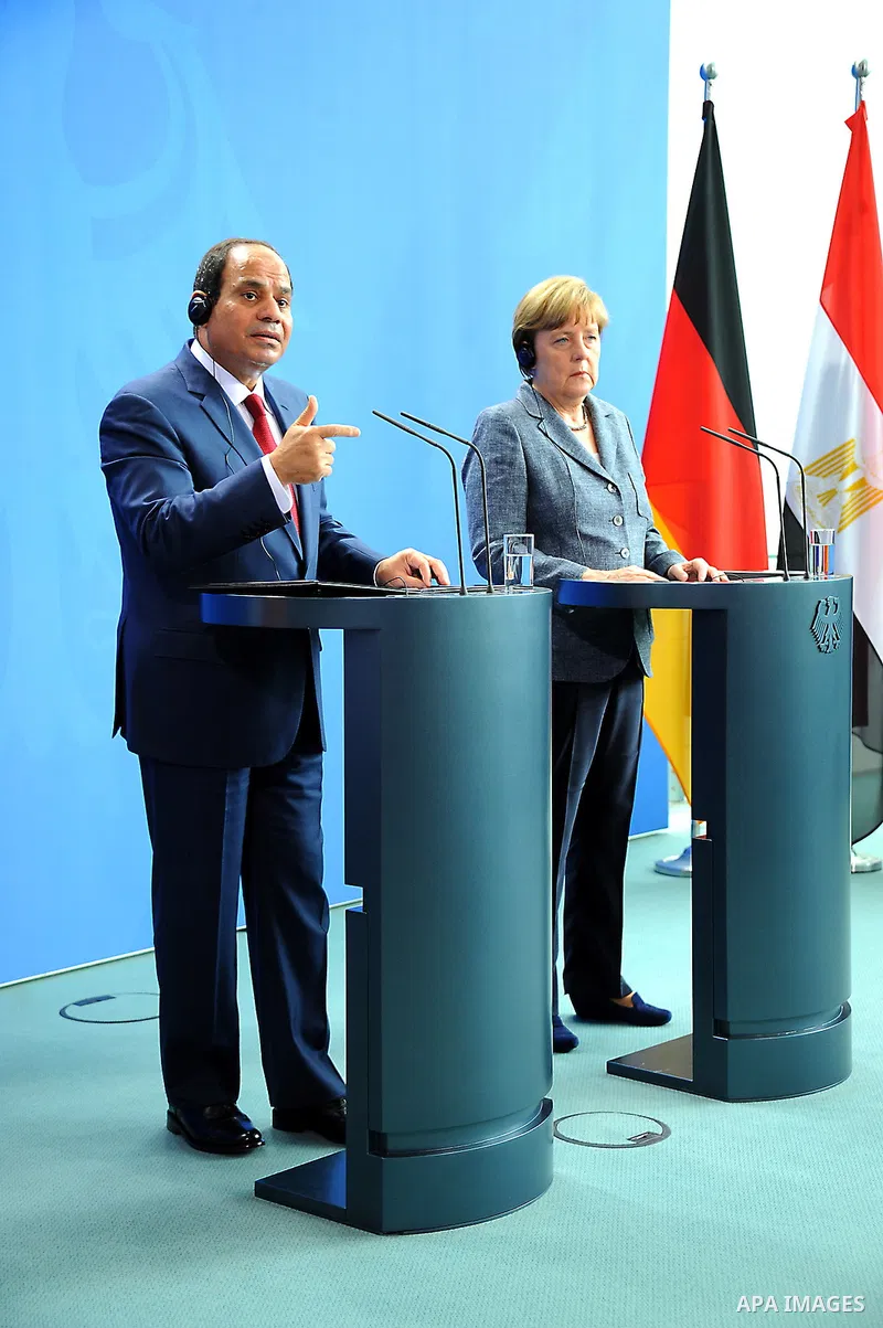 German Chancellor Angela Merkel and Egyptian President Abdel Fattah al-Sisi shake hands attend a press conference on June 3, 2015 at the Chancellery in Berlin. Photo by Egyptian Presidency